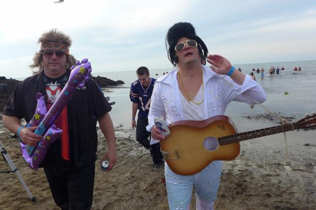 Chris Kinsley (Elvis), and Dave Deck (Canadian Rocker) emerging from the waters off of&nbsp;Woodlawn State Park Beach. Photo by Nancy J. Parisi.
