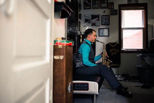 Alex Spencer and his saxophone in his Black Rock apartment. Photo by Shawna Stanley.
