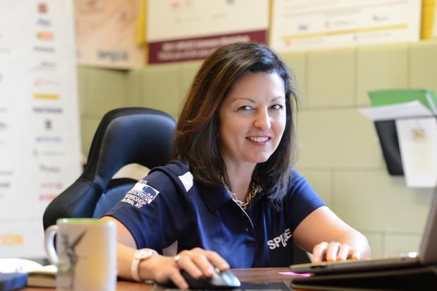 SPLiCE CEO Kimberly Kociencki at her desk in the non-profit's headquarters in the former Annunciation School on Buffalo's West Side. Photo: Nancy J. Parisi
