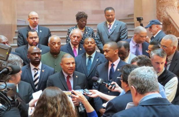 Assemblyman Philip Ramos and fellow members of the Black, Puerto Rican, Hispanic and Asian Legislative Caucus call for criminal justice reforms on the Million Dollar Staircase at the state Capitol on Wednesday. (Ashley Hupfl)
