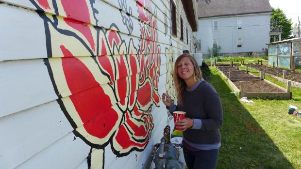 Artist Nicole Cherry working on her OFW mural. Photo: Nancy J. Parisi
