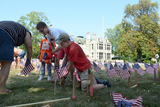 Volunteers place 2,977 American flags on the grounds of American Red Cross on Delaware Avenue at Summer Street on September 6. Photo: Nancy J. Parisi
