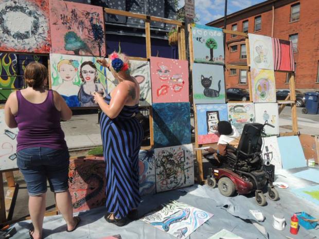 Amy Duengfelder, Cat McCarthy, and and Christopher Shipman at the&nbsp;2015 Buffalo Infringement Festiva art wall.&nbsp;Photo by Heather Gring.&nbsp;
