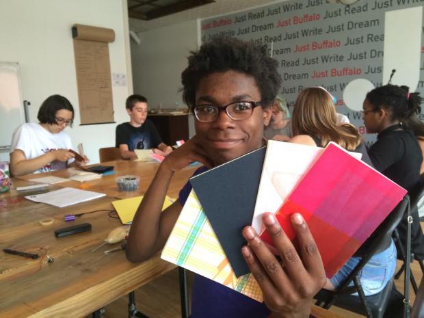 That is JBWC Youth Ambassador, Ikuris, at the JBWC during a chapbook-making workshop taught by Joel Brenden.
