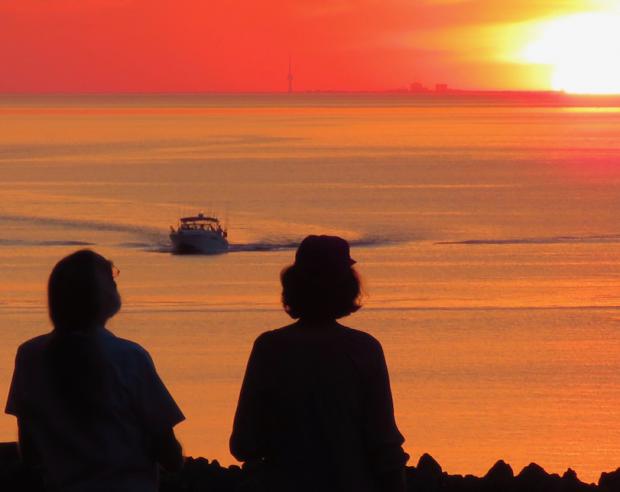 Is the sun setting on Lake Ontario? Shot from Olcott, Toronto on the horizon. Photo by Jay Jurney
