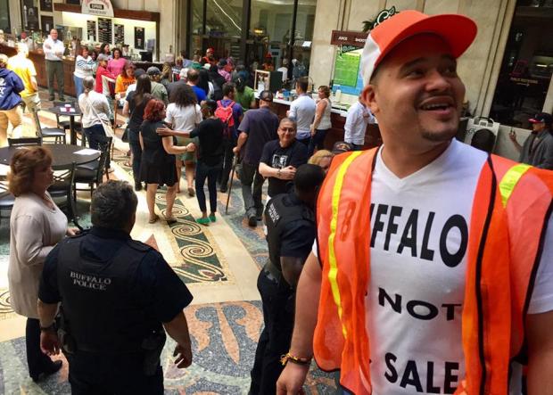 PUSH Buffalo’s Christian Parra during an anti-gentrification protest this past June at the Ellicott Square Building to bring attention to developer Carl Paladino and Ellicott Development’s role in displacing low-income residents and communities of color. Photo by Harper Bishop.
