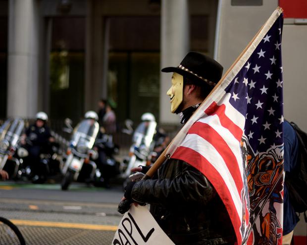 Anonymous marcher on November 5, 2016. Photo by Tom Hilton, courtesy of Creative Commons.
