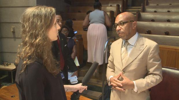 Investigative Post's Daniela Porat questioning Buffalo Common Council President Darius Pridgen after the September 26 meeting of the Council's Police Oversight Committee. Photo courtesy WGRZ-TV.
