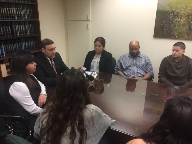 The&nbsp;Hernandez Rossy family with attorney Nelson Torre (second from left).
