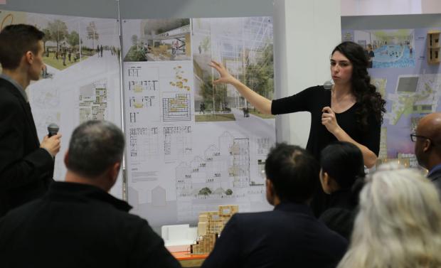 UB architecture students Mike Paraszczak and Liz Gilma present their studio project, which is part of an exhibit hanging in the Hayes Hall lobby.
