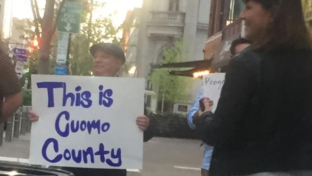 Is this Cuomo "County"? Maybe so, but the protestors at a Cynthia Nixon event last Friday—or at least the signs they held—seemed to have come from out of town. Also, who is the man in the cap?
