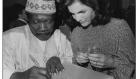 Babatunde Olatunji (left), a Nigerian drummer, educator, social activist and recording artist with Jacqueline Kennedy Onassis at opening for&nbsp;The End of the Game. One of Jacqueline Kennedy Onassis’ major accomplishments was her financial contribution to the arts and historic preservation—ICP was one of the recipients
